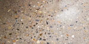 A close-up of a stone floor, showcasing the sleek finish often found in polished concrete floors in London spaces.