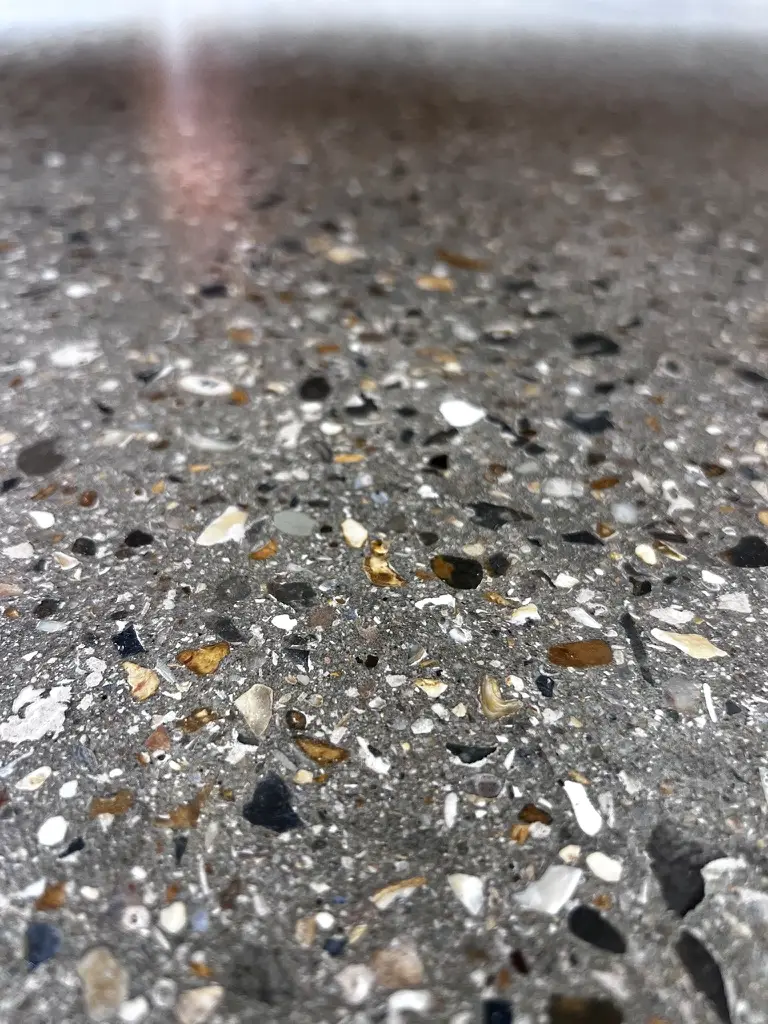 Polished exposed aggregate concrete floor in a Grade II listed barn, Pinner