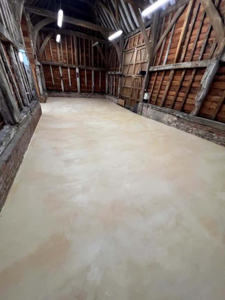 Microcement floor in a Grade II listed barn, Pinner