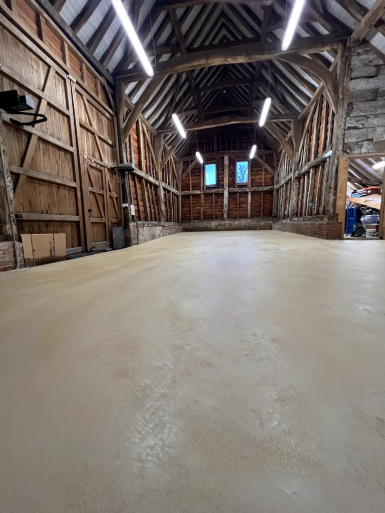 Microcement floor in a Grade II listed barn, Pinner