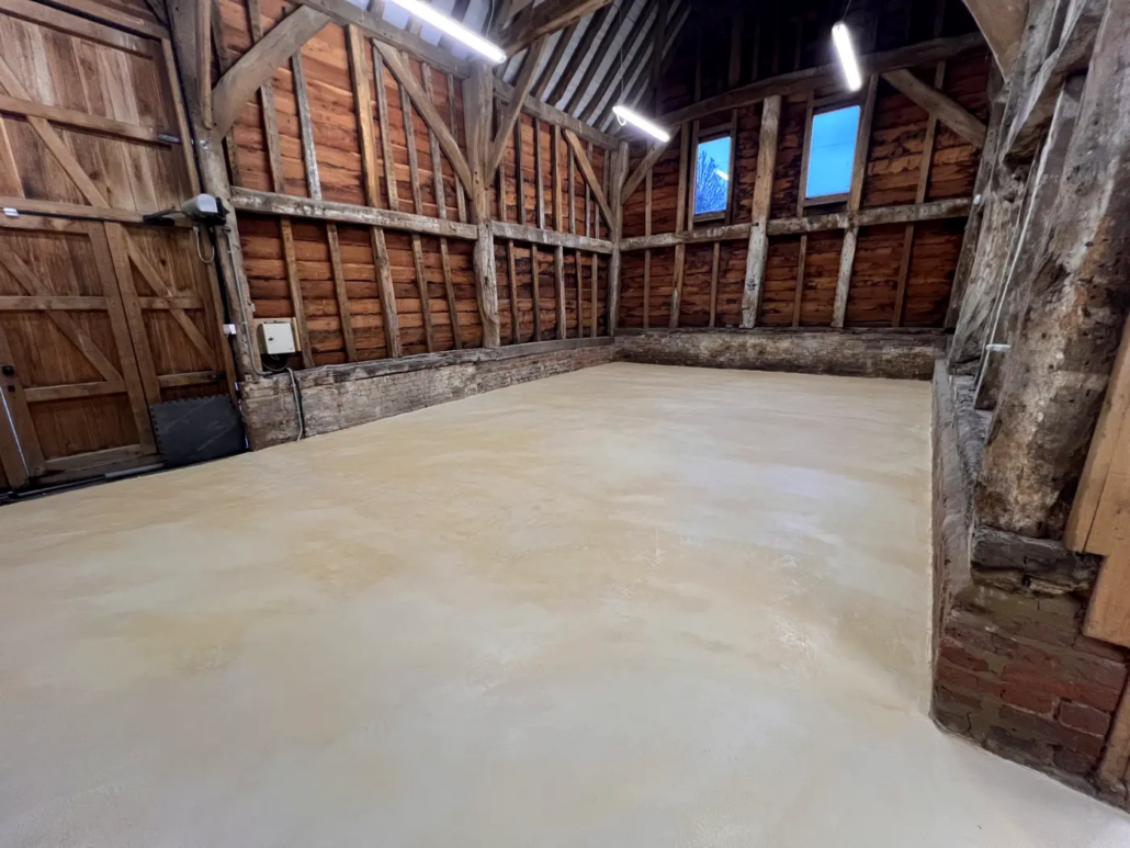 Microcement floor in a Grade II listed barn, Pinner