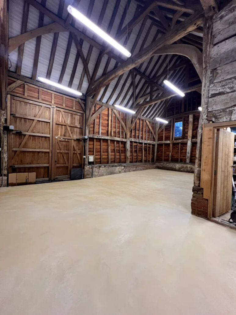 Microcement floor in a Grade II listed barn, Pinner