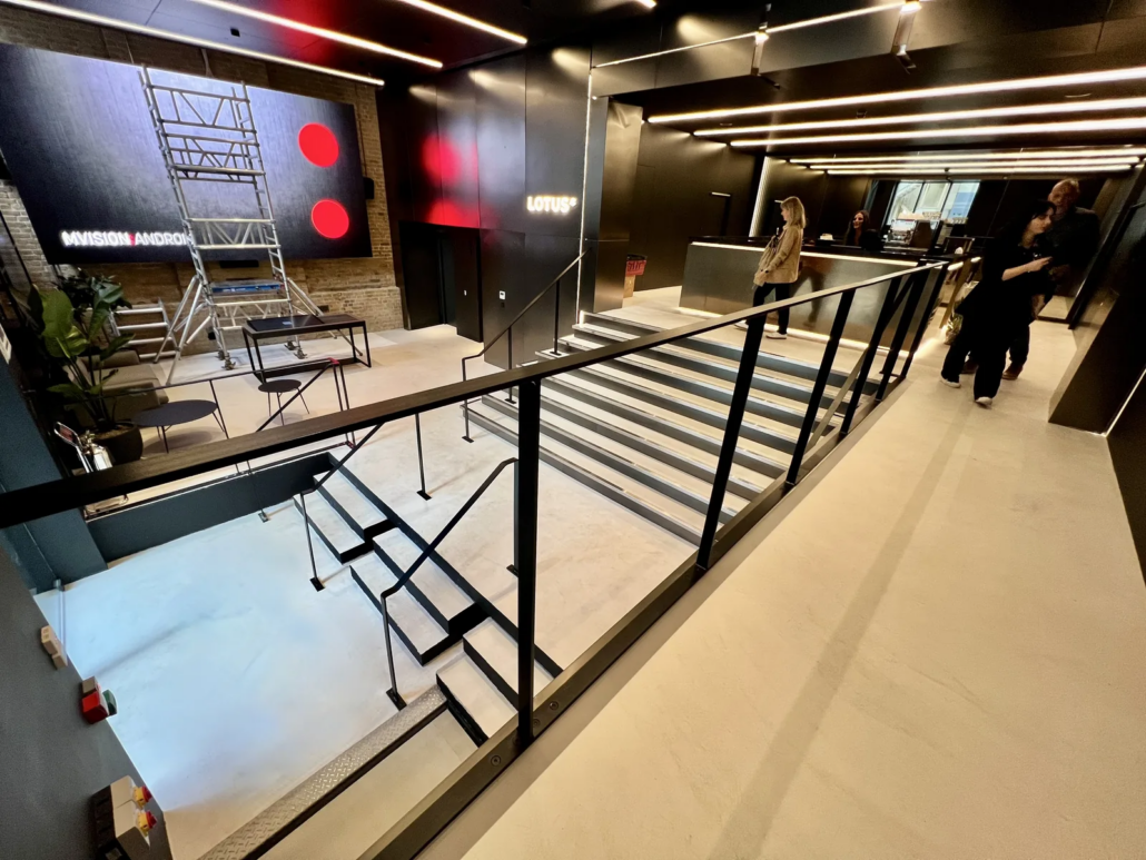 Finished stepped seating on microcement floor — Lotus Cars London HQ, Farringdon