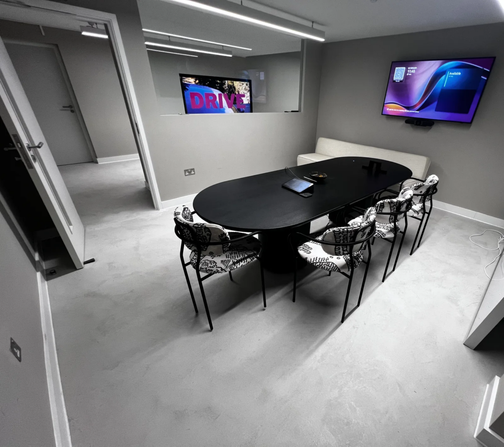Meeting room with microcement floor — J.Lindeberg flagship, London