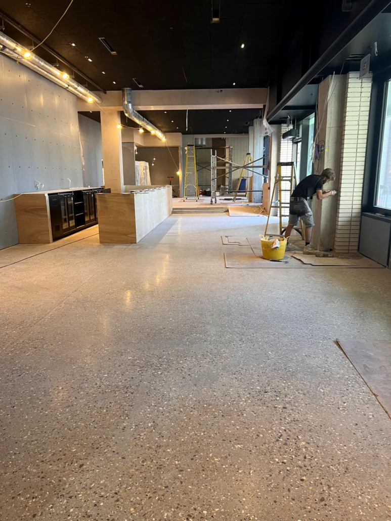 Exposed aggregate polished concrete floor at Always Gladice, Brent Cross