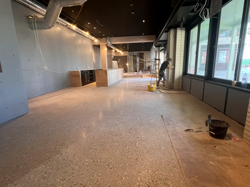 Exposed aggregate polished concrete floor at Always Gladice, Brent Cross