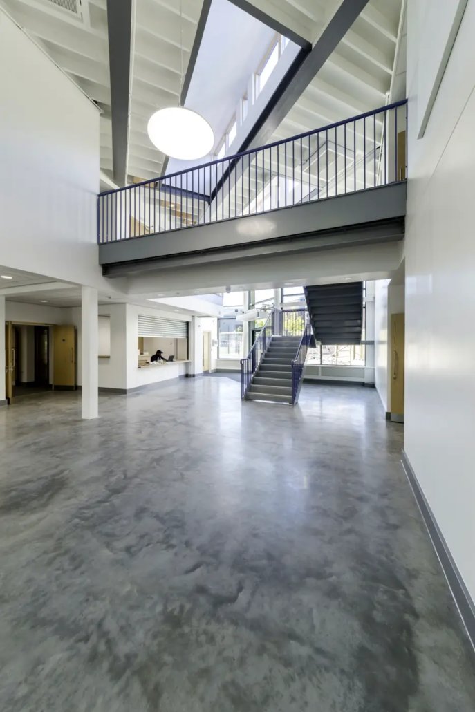 Colour-hardened polished concrete floor at Samuel Rhodes School, Highbury